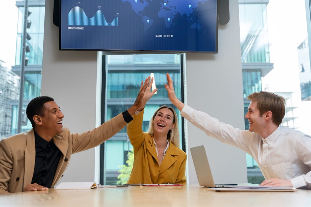 Team collaboration at Dezignlayer Dubai office — diverse creative professionals working together